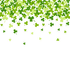 St. Patrick's Day background with green clover leaves falling down with an open space at the bottom for your text. Vector illustration