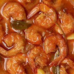 spicy prawn curry with gravy, cooked with fresh curry leaves, chilies and coconut milk, south...