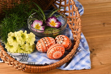 Easter - cheerful colorful Easter eggs - Czech tradition of decorating with wax,still life with Easter eggs and spring flowers,