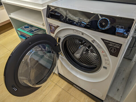 France, March 2 2024: Front Loading Washing Machine in a Domestic Setting.