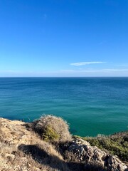 Blue ocean horizon, rocky coast, ocean bay