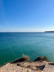 Blue ocean horizon, rocky coast, ocean bay