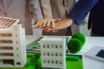Businessmen shake hands after agreeing to start a new project successfully.