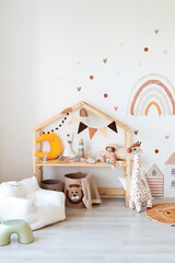 Kids room interior in contemporary, Scandinavian style. Wooden bed, sofa and toys. Cozy room for child. - 749983938