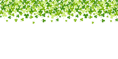 St. Patrick's Day horizontal banner with green clover leaves falling down with an open space at the bottom for your text. Vector illustration on white bakground