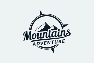 mountain adventure logo with a combination of mountain views, compass and beautiful lettering. © cahiwak