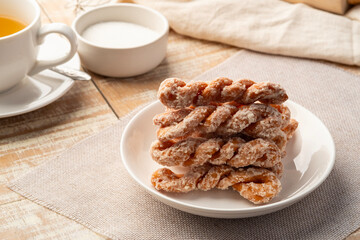 Puffy Twist Donut,mildly sweet and fluffy,twisted sugar doughnuts in white plate