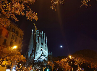 Mesmerising view of the illuminated Basilica de la Sagrada Familia at night.
The Basilica de la Sagrada Familia is a Catholic church under construction in the Eixample district of Barcelona, Spain.