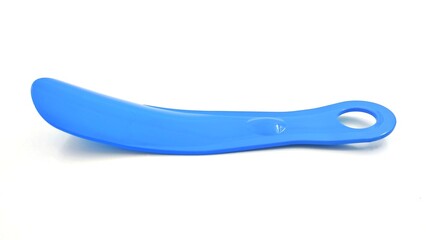 Photo of a blue plastic shoehorn, isolated on white background.