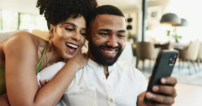 Hug, laughing or happy couple on a phone for social media or streaming subscription on couch in home. Love, mobile notification or funny people with smile, news or meme on internet to search to relax