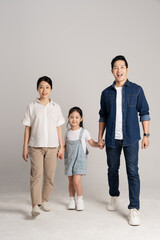Fototapeta premium Asian family portrait posing on white background
