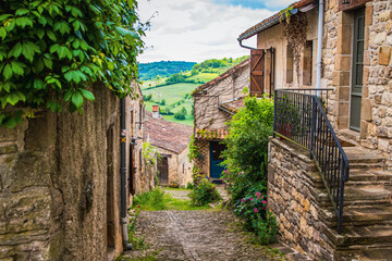 Fototapeta na wymiar Old cobblestone medieval road in the town, the village of Cordes-Sur-Ciel in France
