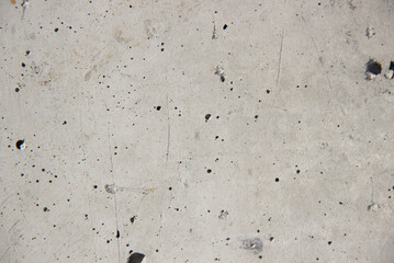 The texture of a gray concrete, old wall.