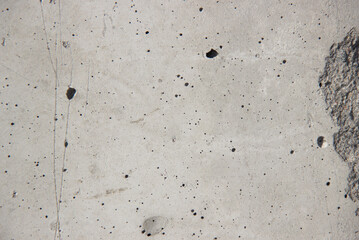 The texture of a gray concrete, old wall.