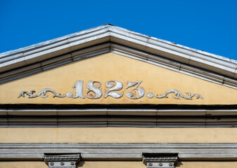 The roof of the old building with the year of construction.
