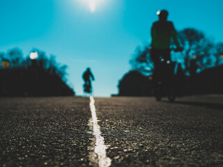 blurred silhouettes of the cycling people