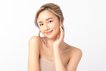 Happy beautiful young asian woman smile touching her face on white background, clean fresh bare skin concept. Facial treatment, Perfect skin, Natural make up.