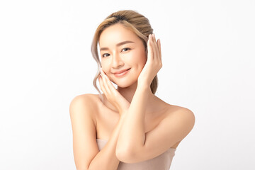 Happy beautiful young asian woman smile touching her face on white background, clean fresh bare skin concept. Facial treatment, Perfect skin, Natural make up.
