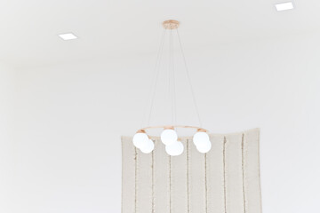 white modern round chandelier on white ceiling