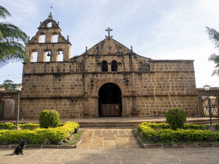Ancient church with bell tower front in Barichara, Colombia.