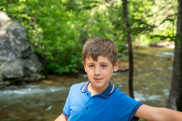 A young caucasian boy visiting Yellowstone National Park