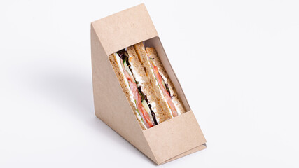 Sandwich in paper isolated on white