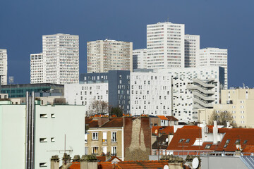 Towers of the 13th arrondissement of Paris city  and roofs of old buildings  in Ivry-sur-Seine city