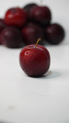 Fresh red plums isolated on a white background