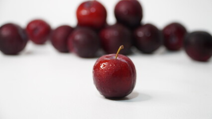 Fresh red plums isolated on a white background