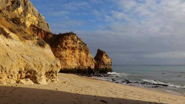 Morning on the Camilo Beach (Praia do Camilo) by the Atlantic Ocean in Algarve region, Lagos, Portugal.