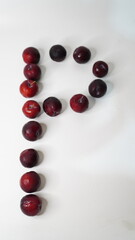 Fresh red plums isolated on a white background