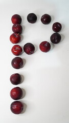 Fresh red plums isolated on a white background