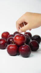 Fresh red plums isolated on a white background