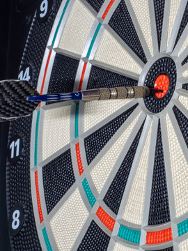dart board with darts. dart in the target. concept hitting the target