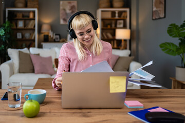 Side hustle money, second job concept. Young university student woman working freelance internet...