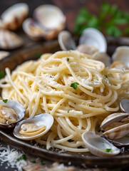 Close-up of Italian spaghetti alle vongole with fresh parsley and clams in a rustic setting.

