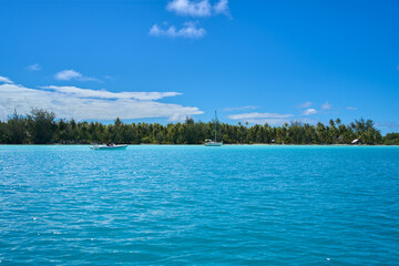 Shallow turquoise waters and shore line on Bora Bora, French Polynesia