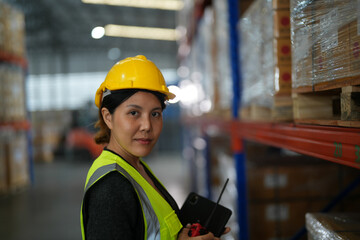 operation worker woman checking and inspecting cargo for stack items for shipping. Staff checking the store factory. industry factory warehouse. Worker Scanning Package In Warehouse.