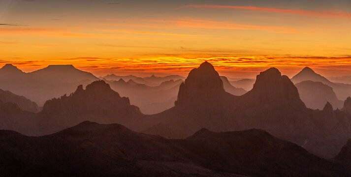 Hoggar landscape in the Sahara desert, Algeria. A view from Assekrem of the sunrise over the Atakor mountains