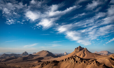 Hoggar landscape in the Sahara desert, Algeria. A view of the mountains and basalt organs that stand around the dirt road that leads to Assekrem.