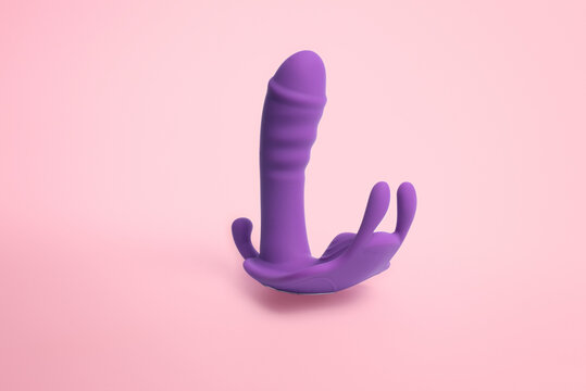 purple triple vibrator on pink background