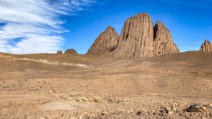 Hoggar landscape in the Sahara desert, Algeria. A view of the mountains and basalt organs that stand around the dirt road that leads to Assekrem. - 750082395