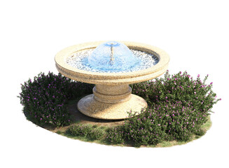 fountain surrounded by grass flowers and small plant