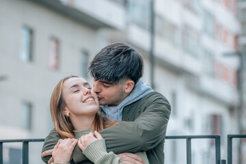 wedding couple hugging on the street