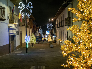 Christmas decorated evening street in Bogotá. Colombia - 750101377
