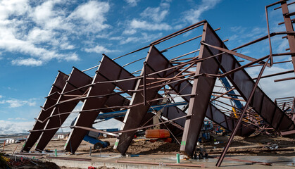 Naklejka premium Metal plane hanger collapsed on equipment beneath