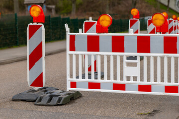 warning barrier on a road in front of a construction site