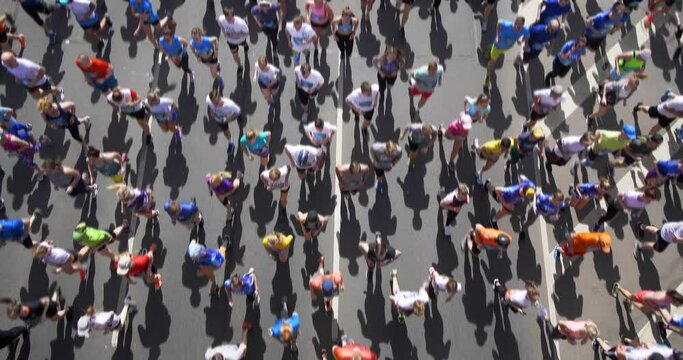 4K - Wide angle view of a blurred motion of marathon