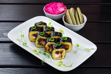 Set of salad in the form of rolls from mushroom, boiled potatoes, onions, carrots, cream cheese...