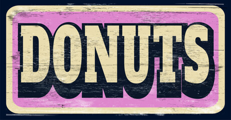 Aged vintage donuts sign on wood